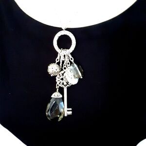 Lia Sophia silver tone 28"necklace multiple pendants key cameo
